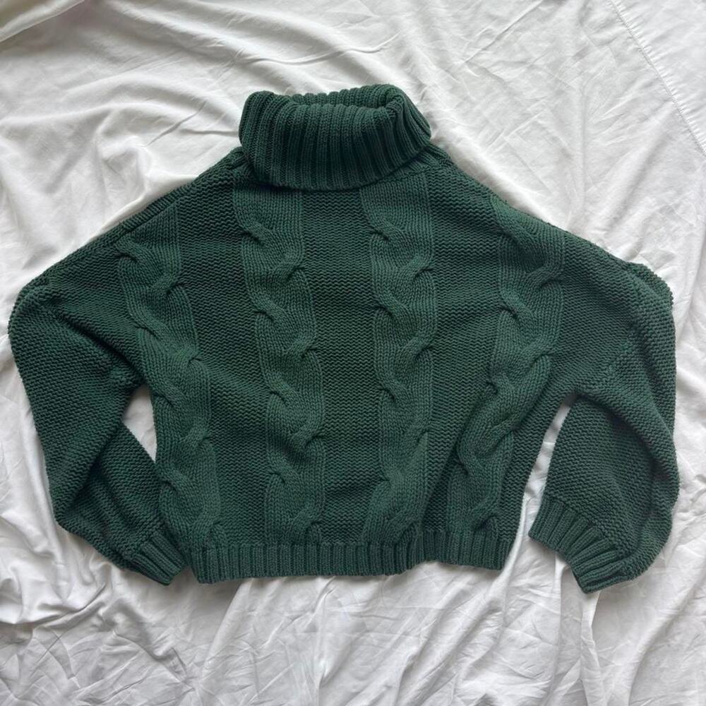 Green cable knit turtleneck sweater